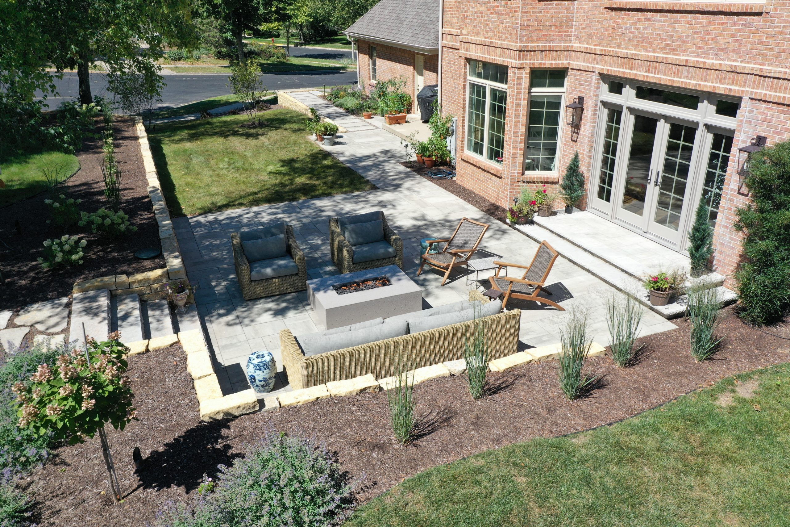 Remodeled outdoor living space with seating and landscape Carrington Lawn & Landscape in Middleton, WI
